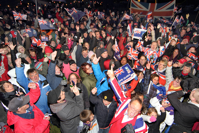 Islanders celebrate after the annouce of the referendum's result in Port Stanley, Falkland (Malvinas for Argentina) Islands, on March 11, 2013 (AFP Photo / Tony Chater) 
