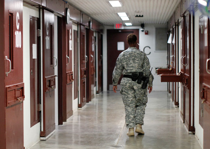 A guard walks through a cellblock inside Camp V, a prison used to house detainees at Guantanamo Bay U.S. Naval Base.(Reuters / Bob Strong)