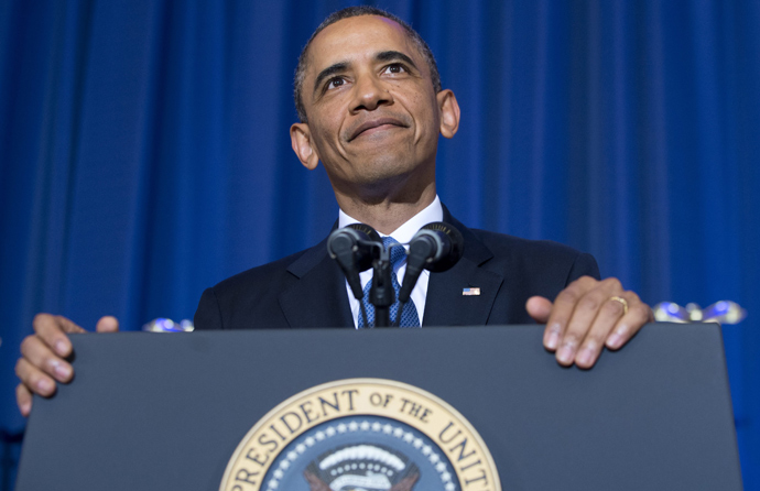 US President Barack Obama listens as a protester shouts during a speech about his administration's drone and counterterrorism policies, as well as the military prison at Guantanamo Bay, at the National Defense University in Washington, DC, May 23, 2013 (AFP Photo / Saul Loeb)