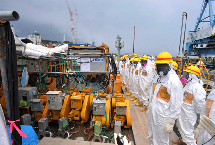 This photo taken on August 6, 2013 shows local government officials and nuclear experts inspecting a facility to prevent seeping of contamination water into the sea at Tokyo Electric Power's (TEPCO) Fukushima Dai-ichi nuclear plant (Japan out AFP Photo / Japan Pool via JIJI Press) 