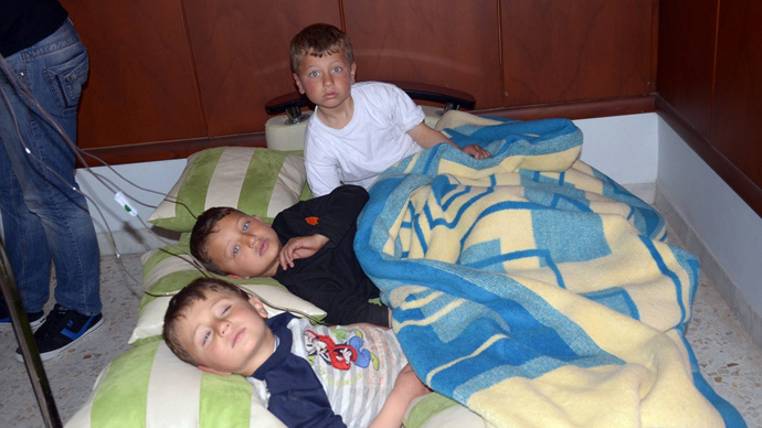 In this image made available by the Syrian News Agency (SANA) on March 19, 2013, three boys rest on cushions laid on the floor of a hospital in the Khan al-Assal region in the northern Aleppo province, as Syria's government accused rebel forces of using chemical weapons for the first time (AFP Photo)