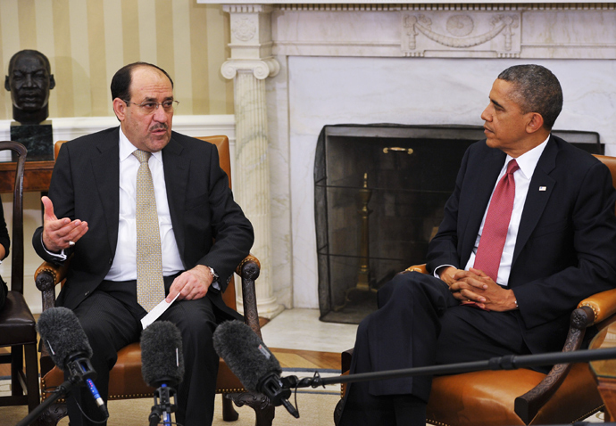 Iraqi Prime Minister Nuri al-Maliki (L) speaks during a meeting with US President Barack Obama during a meeting in the Oval Office of the White House on November 1, 2013 in Washington (AFP Photo / Mandel Ngan)