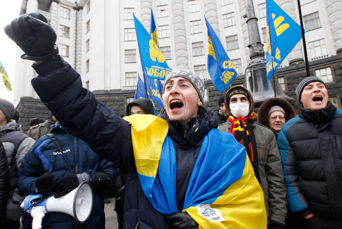 People shout slogans in front of the Ukrainian cabinet of ministers building during a rally to support EU integration in Kiev December 4, 2013.(Reuters / Vasily Fedosenko)
