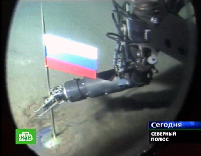 A Russian NTV channel grab taken 03 August 2007 shows a manipulator of the Mir-1 mini-submarine as it places a Russian state flag at the seabed of Arctic ocean at a depth of 4,261 meters (13,980 feet), 02 August 2007. (AFP Photo / NTV) 