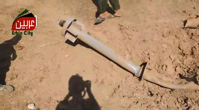 An image grab taken from a video uploaded on August 22, 2013 shows, what rebels claim to be, one of the missiles carrying chemicals that targeted eastern Ghouta, on the outskirts of Damascus. (AFP Photo / Youtube / Arbeen Unified Press Office) 