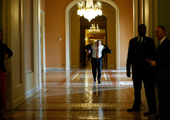 U.S. Senator Richard Burr (R-NC) walks from a Republican caucus meeting to the Senate floor for a vote on whether to raise the debt ceiling, at the U.S. Capitol in Washington February 12, 2014.(Reuters / Jonathan Ernst)