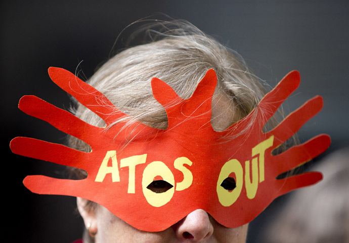 A protester demonstrates against IT company Atos's involvement in tests for incapacity benefits outside the Department for Work and Pensions in London (Reuters/Neil Hall)