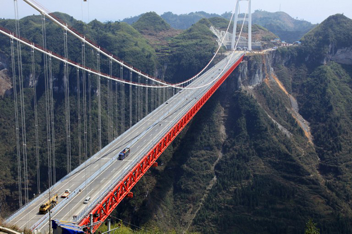 The Aizhai bridge, the worldÃs highest tunnel to tunnel bridge, at 336 meter-high (1,102 feet) and spanning 1,176 meters (3,858 feet), officially opens to traffic in Jishou, central China's Hunan province on March 31, 2012. (AFP Photo)