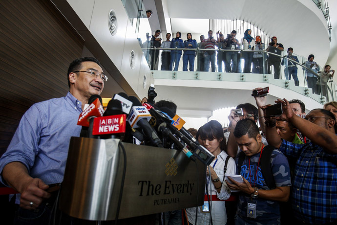 Malaysia's acting Transport Minister Hishammuddin Hussein (L) speaks about the search for the missing Malaysia Airlines Flight MH370 during a news conference at The Everly Hotel in Putrajaya March 29, 2014. (Reuters)