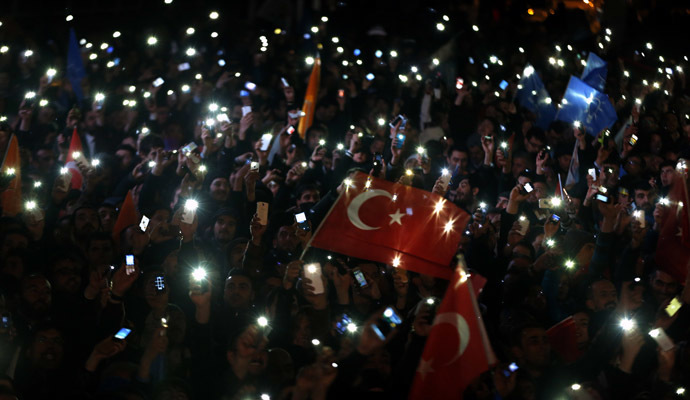 Supporters of Turkey's Prime Minister Tayyip Erdogan turn on their mobile phones as they celebrate their election victory in front of the party headquarters in Ankara March 31, 2014. (Reuters)