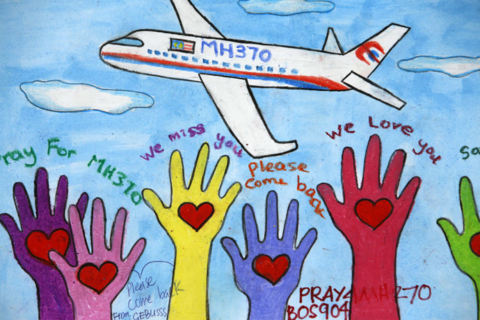 An artwork conveying well-wishes for the passengers and crew of the missing Malaysia Airlines Flight MH370 is seen at a viewing gallery in Kuala Lumpur International Airport March 19, 2014. (Reuters)