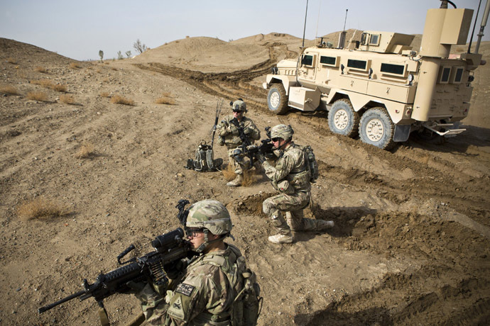 U.S. Army soldiers with Charlie Company, 36th Infantry Regiment, 1st Armored Division set up a supportive position during a mission near Command Outpost Pa'in Kalay in Maiwand District, Kandahar Province February 3, 2013. (Reuters/Andrew Burton)