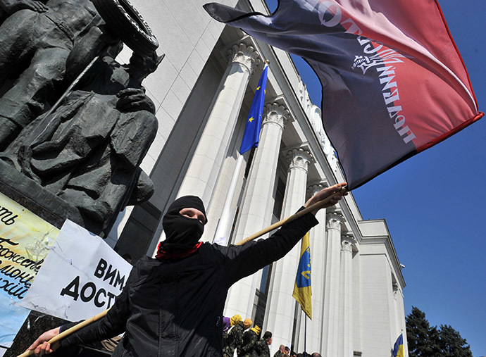 Supporters of the right wing party Pravyi Sector (Right Sector) protest in front of the Ukrainian parliament in Kiev on March 28, 2014. (AFP Photo / Genya Savilov)