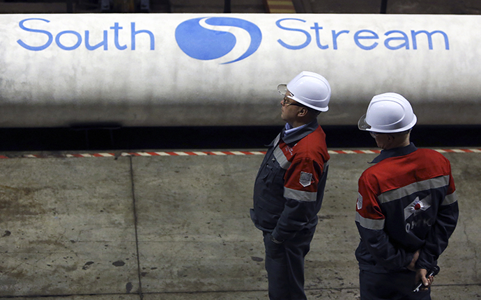 Employees stand near pipes made for the South Stream pipeline at the OMK metal works in Vyksa in the Nizhny Novgorod region April 15, 2014. (Reuters / Sergei Karpukhin)