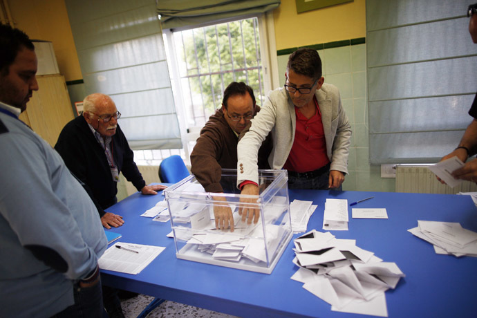 Members of the electoral table count the ballots after the European Parliament elections at a polling station in Ronda, near Malaga, southern Spain, May 25, 2014. (Reuters/Jon Nazca)
