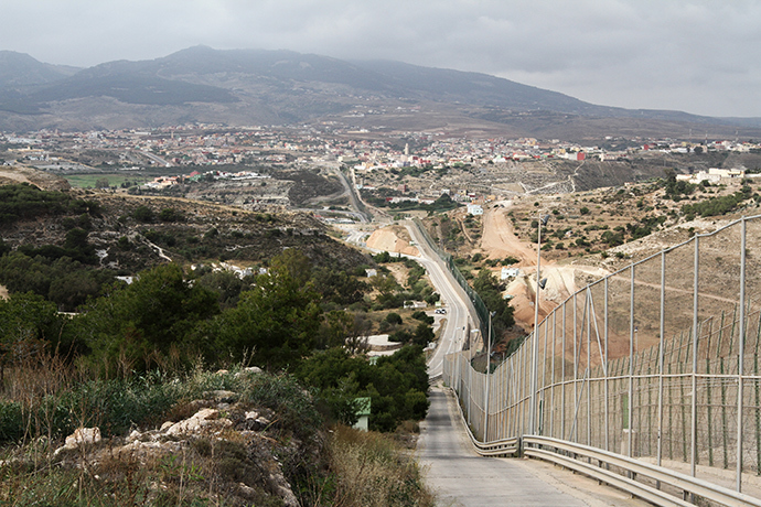 Melillaâs wall and Mount Gurugu. Photo by @TomasoClavarino