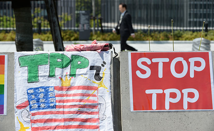 Placards are placed on the wall during a sit-in protest against the Trans Pacific Partnership (TPP) trade deal (AFP Photo / Toshifumi Kitamura)