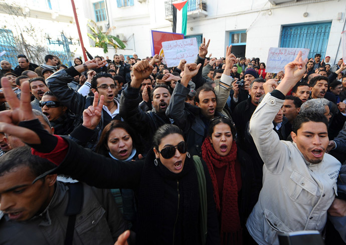 People shout slogans to show their solidarity with the residents of Sidi Bouzid during a demonstration on December 27, 2010 in Tunis. (AFP Photo)