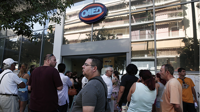 People wait outside a Greek Manpower Employment Organisation (OAED) office at Kalithea suburb in Athens (Reuters / Yorgos Karahalis)