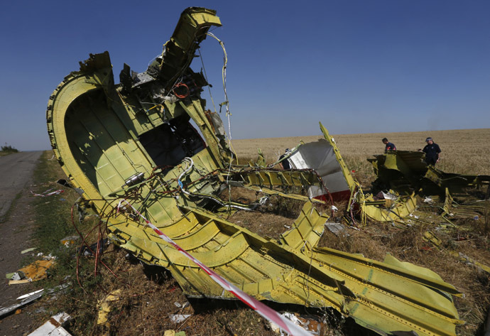 Members of a group of international experts inspect the site where the downed Malaysia Airlines flight MH17 crashed, near the village of Hrabove (Grabovo) in Donetsk region, eastern Ukraine August 1, 2014. (Reuters)