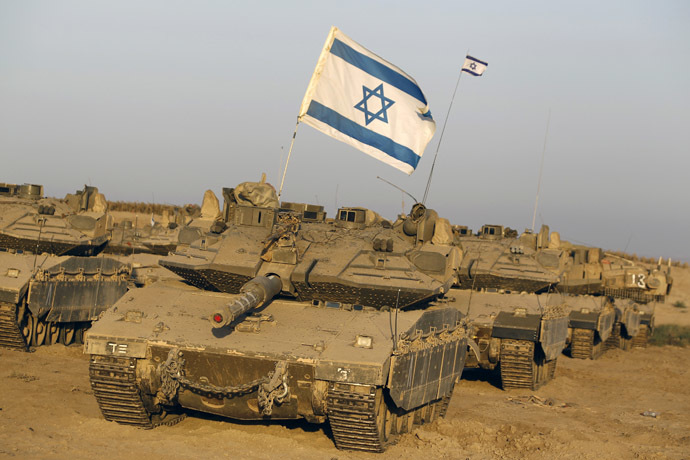 Israeli tanks are seen in a staging area near the border with the Gaza Strip August 7, 2014. (Reuters)