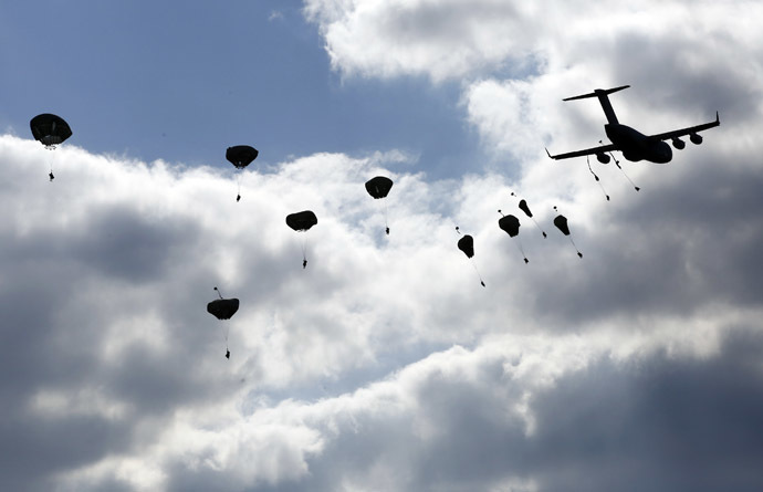Troops from the U.S. Army's 173rd Infantry Brigade Combat Team parachute from a Boeing C-17 Globemaster III during a NATO-led exercise "Orzel Alert" held together with Canada's 3rd Battalion and Princess Patricia's Light Infantry, and Poland's 6th Airborne Brigade in Bledowska Desert in Chechlo, near Olkusz, south Poland May 5, 2014. (Reuters)