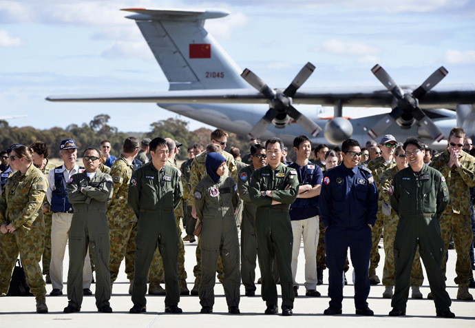 International and Australian aircrews involved in the search for missing Malaysia Airlines plane MH370 prepare for an official photograph as they stand on the tarmac at the Royal Australian Air Force (RAAF) Pierce Base in Bullsbrook, near Perth, April 29, 2014. (Reuters)