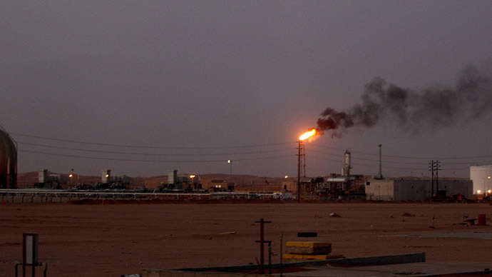 A flame from a Saudi Aramco (the national oil company) oil installation known as "Pump 3" burns brightly during sunset in the Saudi Arabian desert near the oil-rich area Al-Khurais. (AFP Photo/Marwan Naamani)