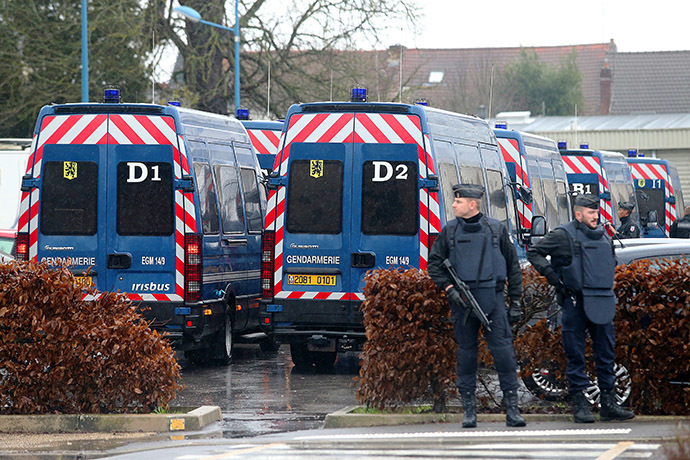 Members of French Gendarmerie are pictured in Corcy, near Villers-Cotterets, north-east of Paris, on January 8, 2015, where the two armed suspects from the attack on French satirical weekly newspaper Charlie Hebdo were spotted in a gray Clio. (AFP Photo/Francois Nascimbeni)