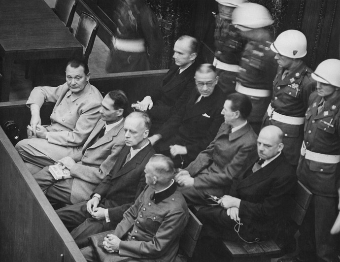 Nuremberg Trials. Defendants in their dock, circa 1945-1946. (in front row, from left to right): Hermann GÃ¶ring, Rudolf HeÃ, Joachim von Ribbentrop, Wilhelm Keitel (in second row, from left to right): Karl DÃ¶nitz, Erich Raeder, Baldur von Schirach, Fritz Sauckel (Image from Wikipedia)
