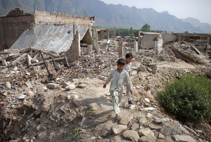Boys walk through the rubble of destroyed homes in Buner district which is located about 220 km (137 miles) by road northwest of Pakistan's capital Islamabad, September 14, 2009. (Reuters/Faisal Mahmood)