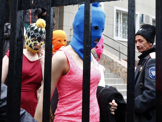 Masked members of protest band Pussy Riot leave a police station in Adler during the 2014 Sochi Winter Olympics, February 18, 2014. (Reuters/Shamil Zhumatov)