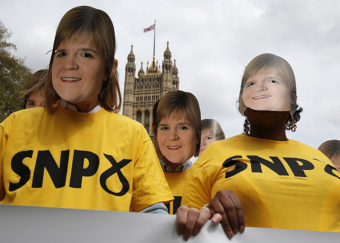 Conservative Party activists wear face masks of Scottish National party leader Nicola Sturgeon during a stunt outside the Houses of Parliament, in central London, Britain, May 1, 2015. (Reuters/Peter Nicholls)