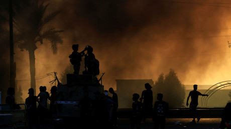 Des forces de sécurité irakiennes lors de la repression des manifestations du 2 octobre, à Bagdad.