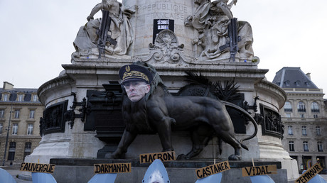 Une image du préfet de police de Paris Didier Lallement sur une statue de la place de la République à Paris, le 16 mars 2021, lors d'une action des militants d'Attac pour protester contre la loi Sécurité globale.