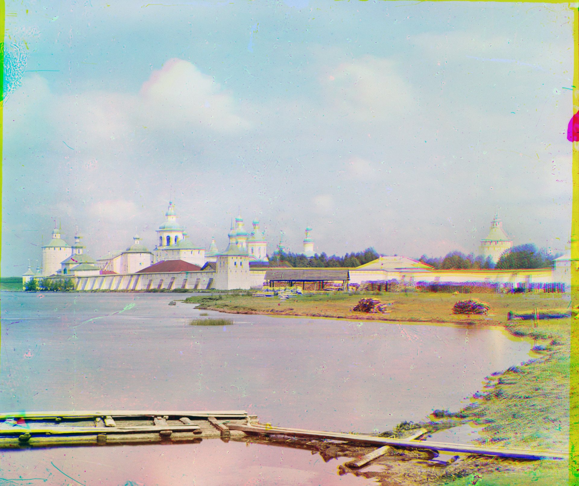St. Kirill Belozersky Monastery. Southeast view with south shore of Siverskoe Lake. Center: Svitochnaia Tower. Summer 1909.