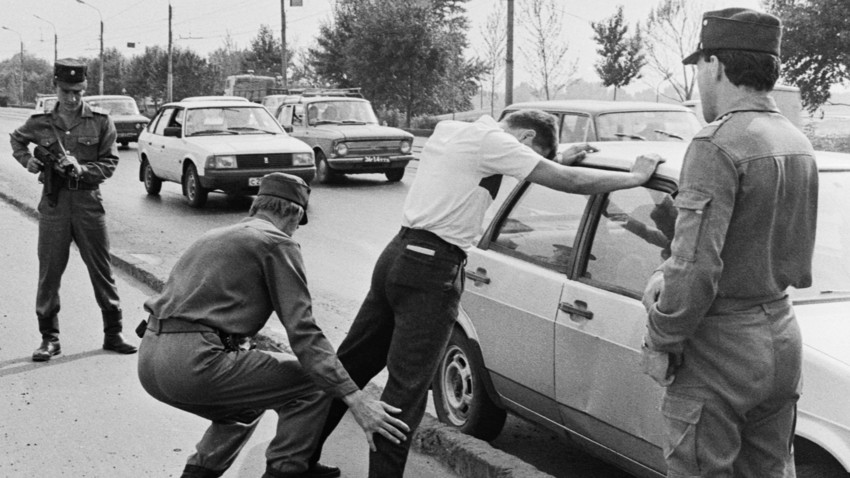 Kazan police officers detain a suspect during a raid, 1992