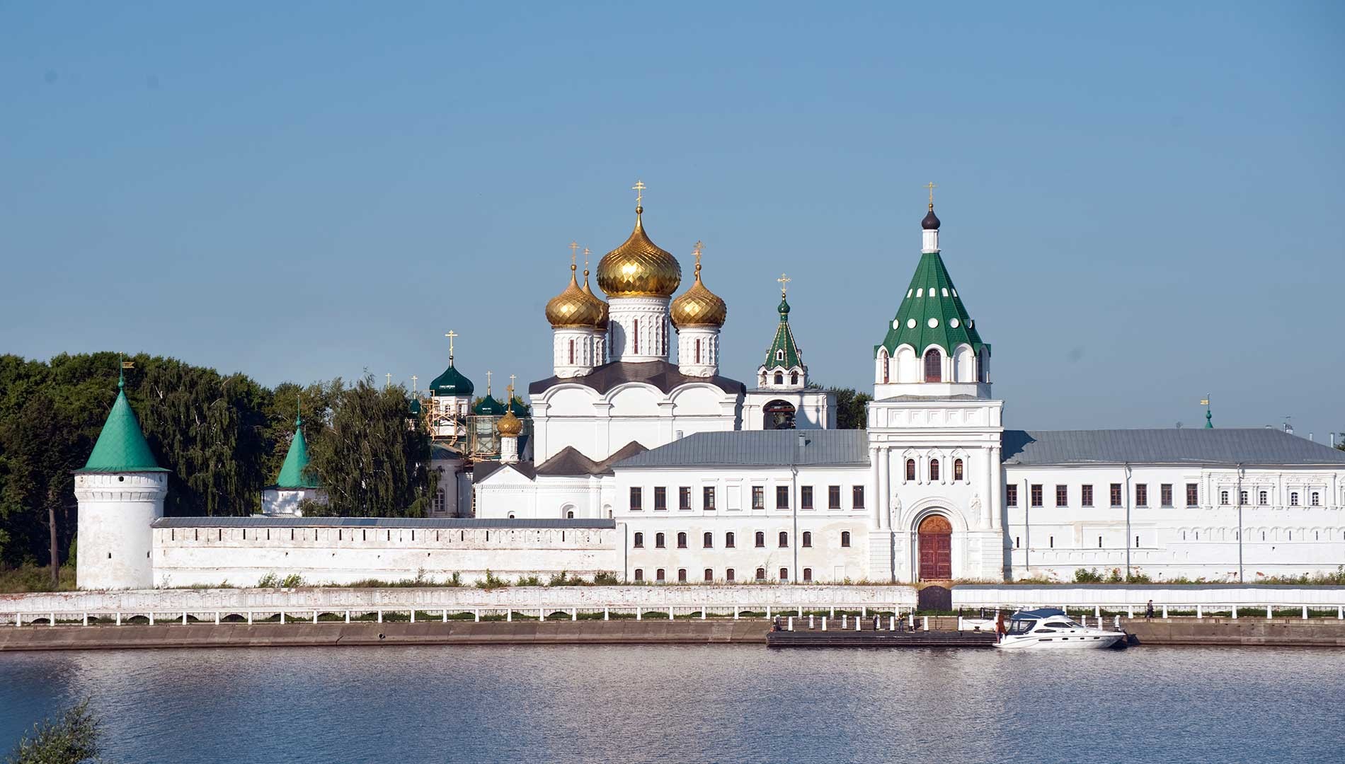 Trinity-Ipatiev Monastery, east view across Kostroma River. From left: Water Tower; Cathedral of Nativity of the Virgin; Trinity Cathedral; bell tower; Archbishop's Cloisters with Gate Church of Sts. Chrysanthus & Daria. Aug. 13, 2017.