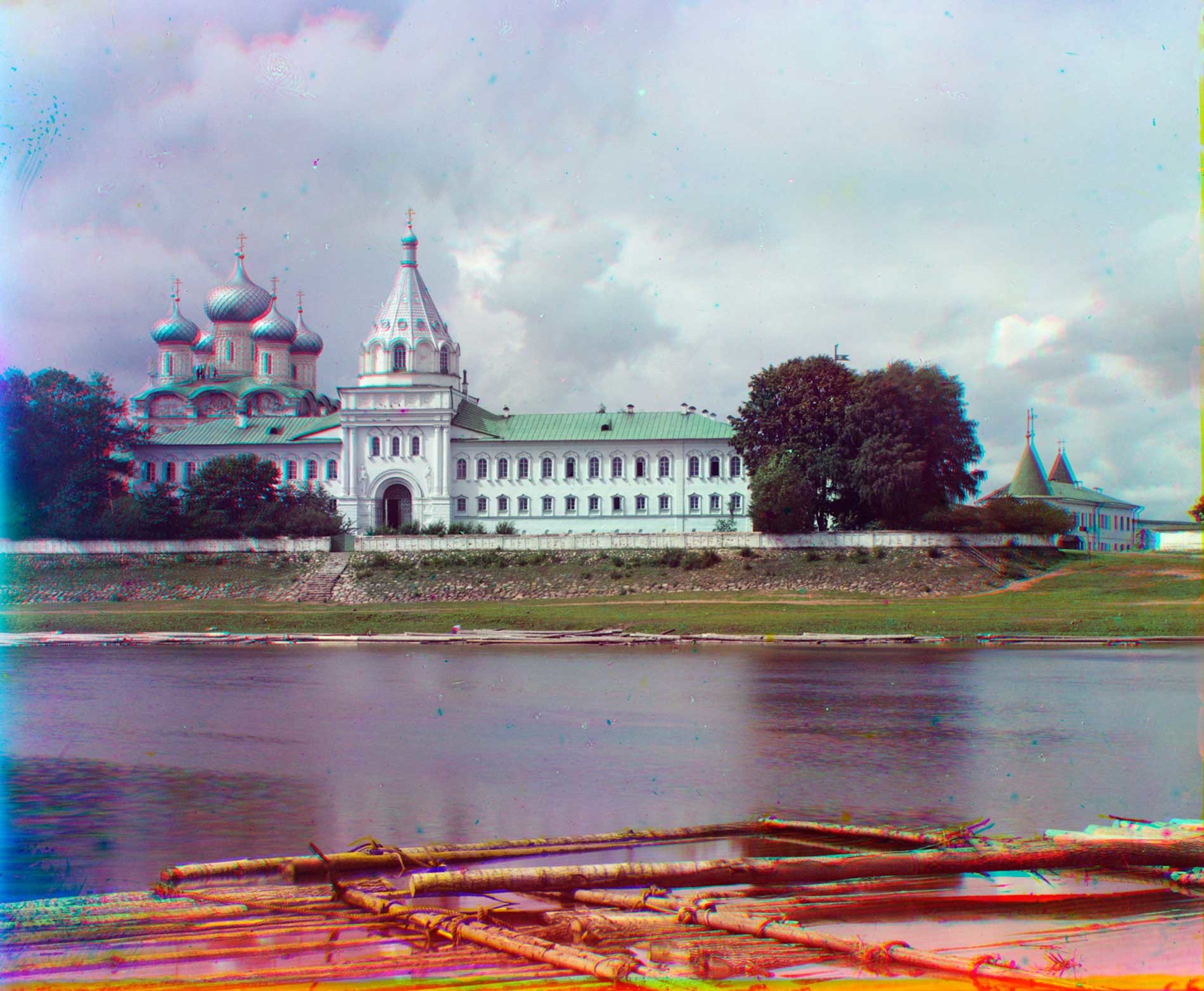 Trinity-Ipatiev Monastery, east view across Kostroma River. From left: Trinity Cathedral; bell tower; Archbishop's Cloisters with Gate Church of Sts. Chrysanthus & Daria; Powder Tower. Summer 1911.