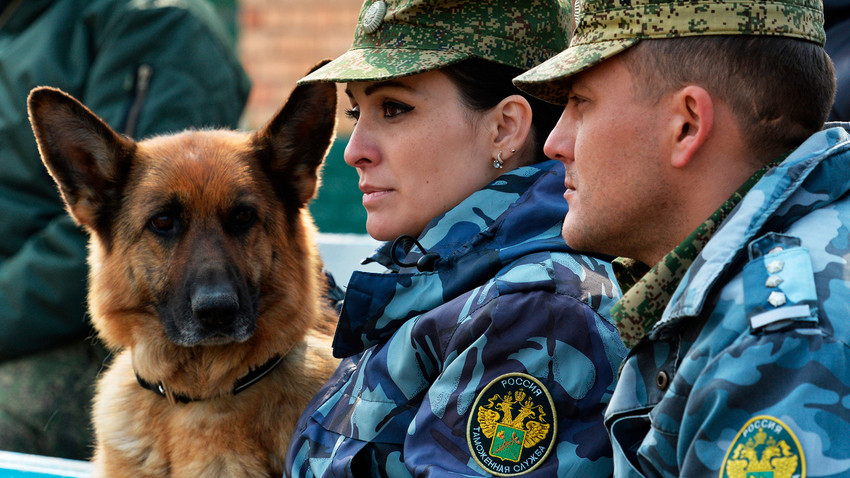 Russian customs officials with a dog