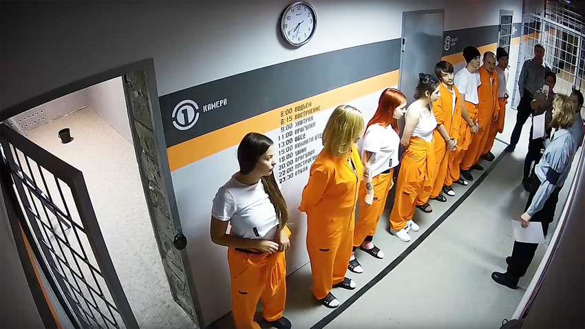 Participants of the Experiment 12 show, trying to win money and fame, live lives of prisoners