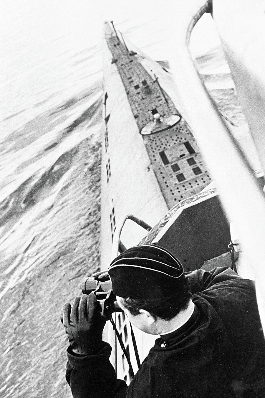 Soviet submarine commander scans the horizon through binoculars in 1968