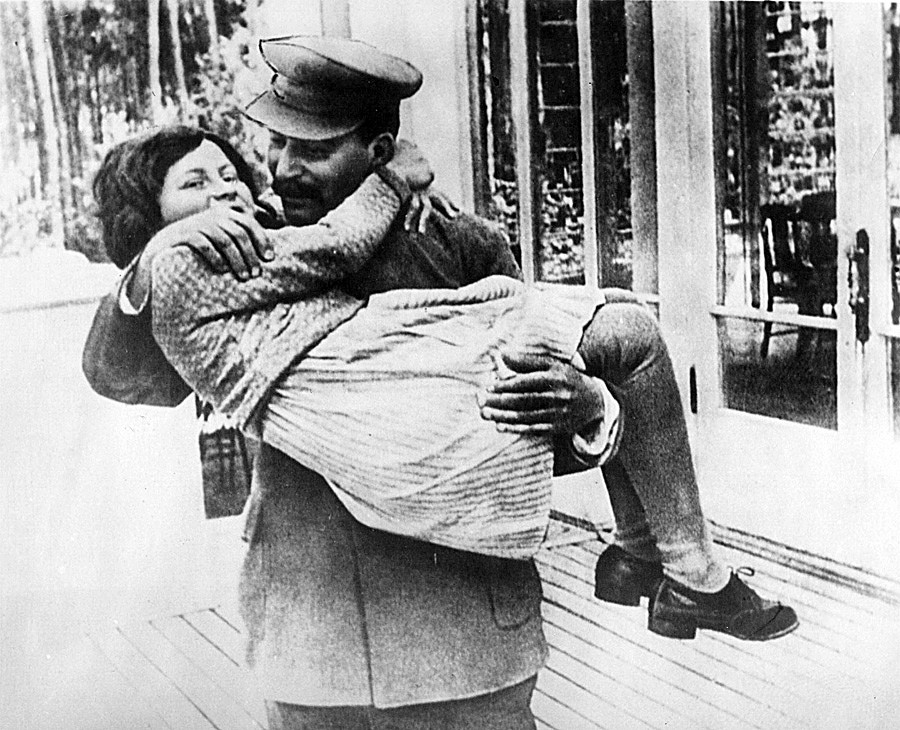 Joseph Stalin holding his daughter Svetlana Alliluyeva. Father and daughter used to be close but only when through Svetlana's childhood.