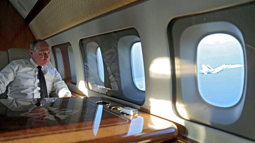 Vladimir Putin aboard the presidential plane during a flight to the Khmeimim Air Base in Syria. 