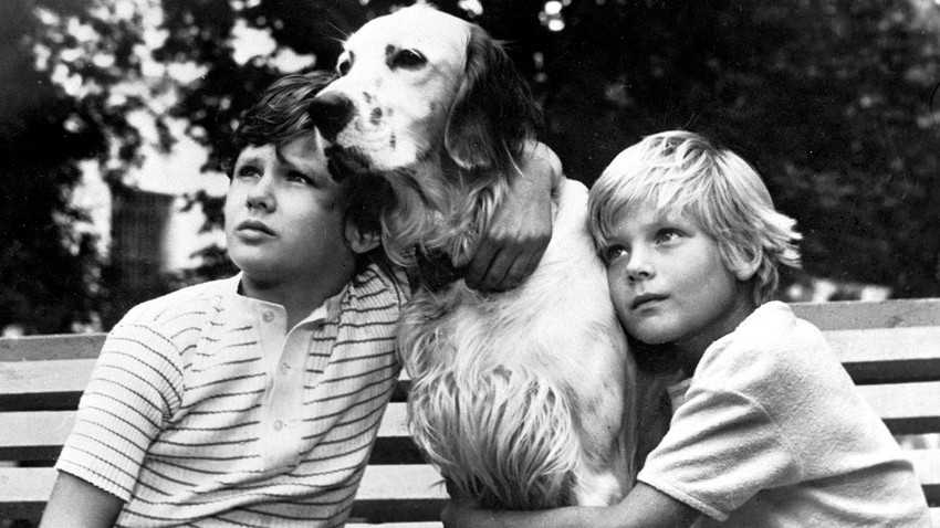 Kids with a dog in a scene from the movie "White Bim the Black Ear" based on the story by Gavriil Troyepolsky