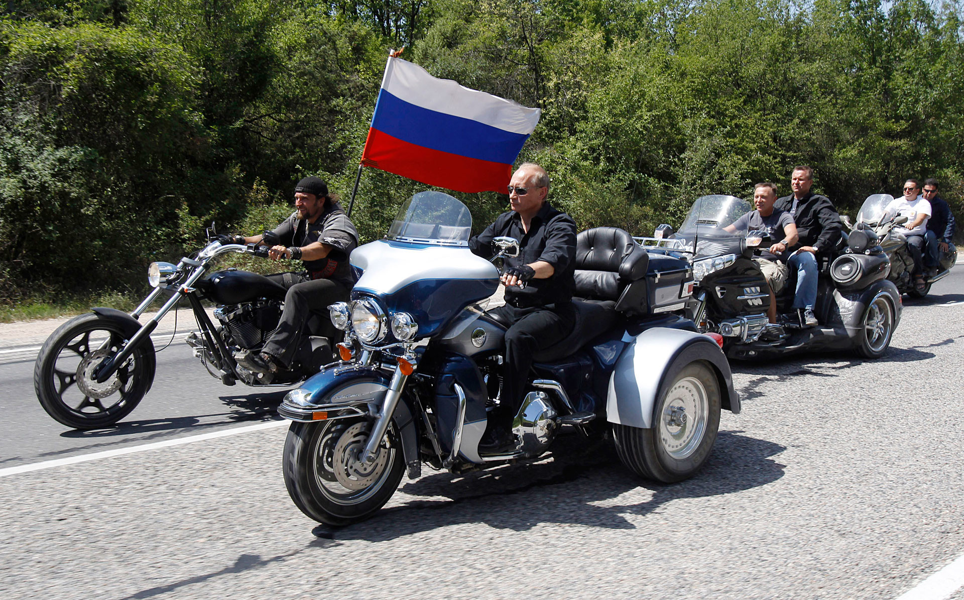 Vladimir Putin rides a Harley Davidson Lehman Trike as he arrives for a meeting with Russian and Ukrainian bikers.