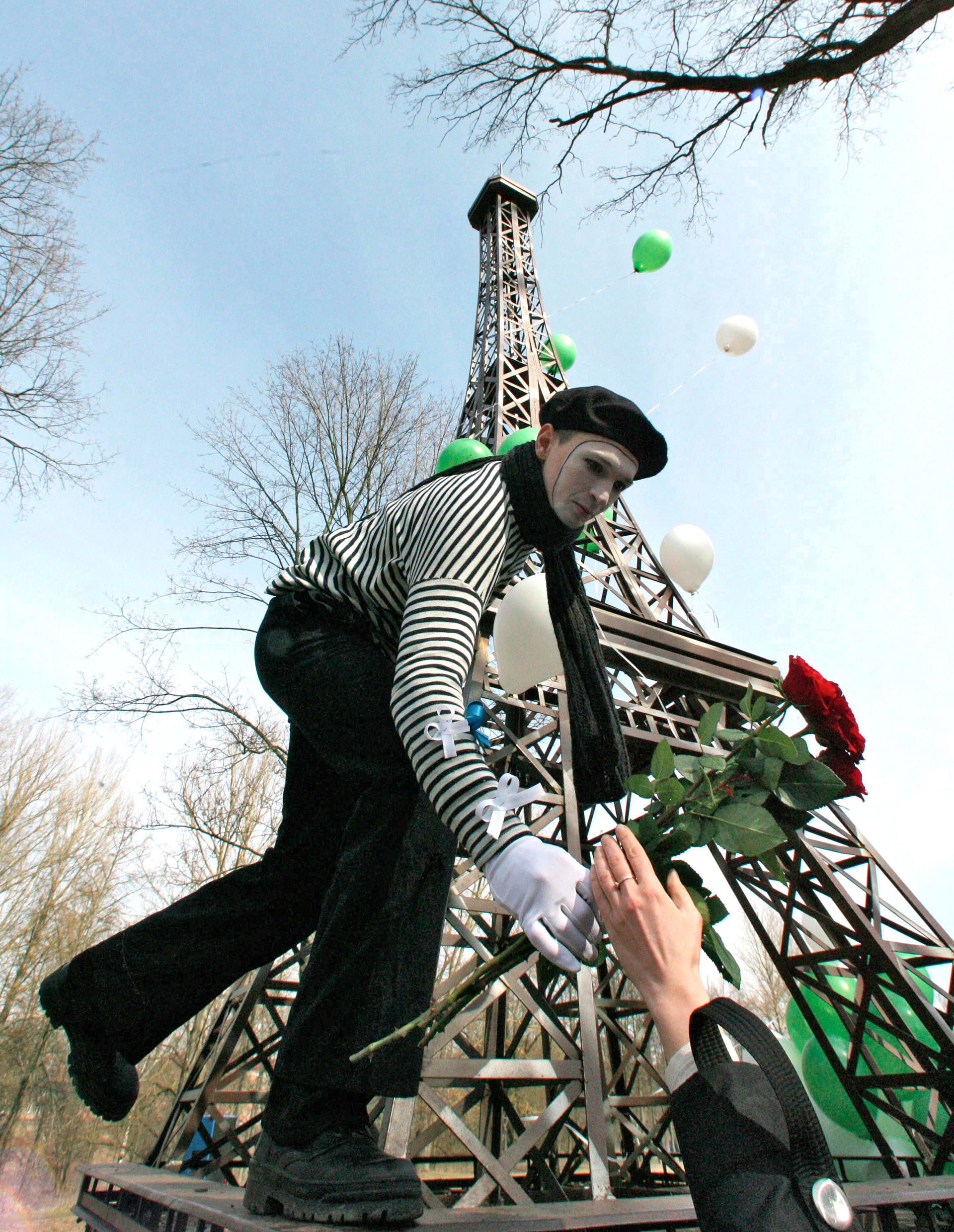 Outdoor festivities to mark the 120th anniversary of the Eiffel Tower near its 8-meter-tall copy in the town park of Gusev, Kaliningrad Region.