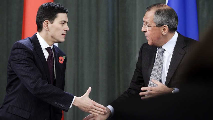 Russian Foreign Minister Sergey Lavrov, right, shakes hands his visiting Britain's counterpart David Miliband, left, during their news conference meeting in Moscow, Nov. 2, 2009