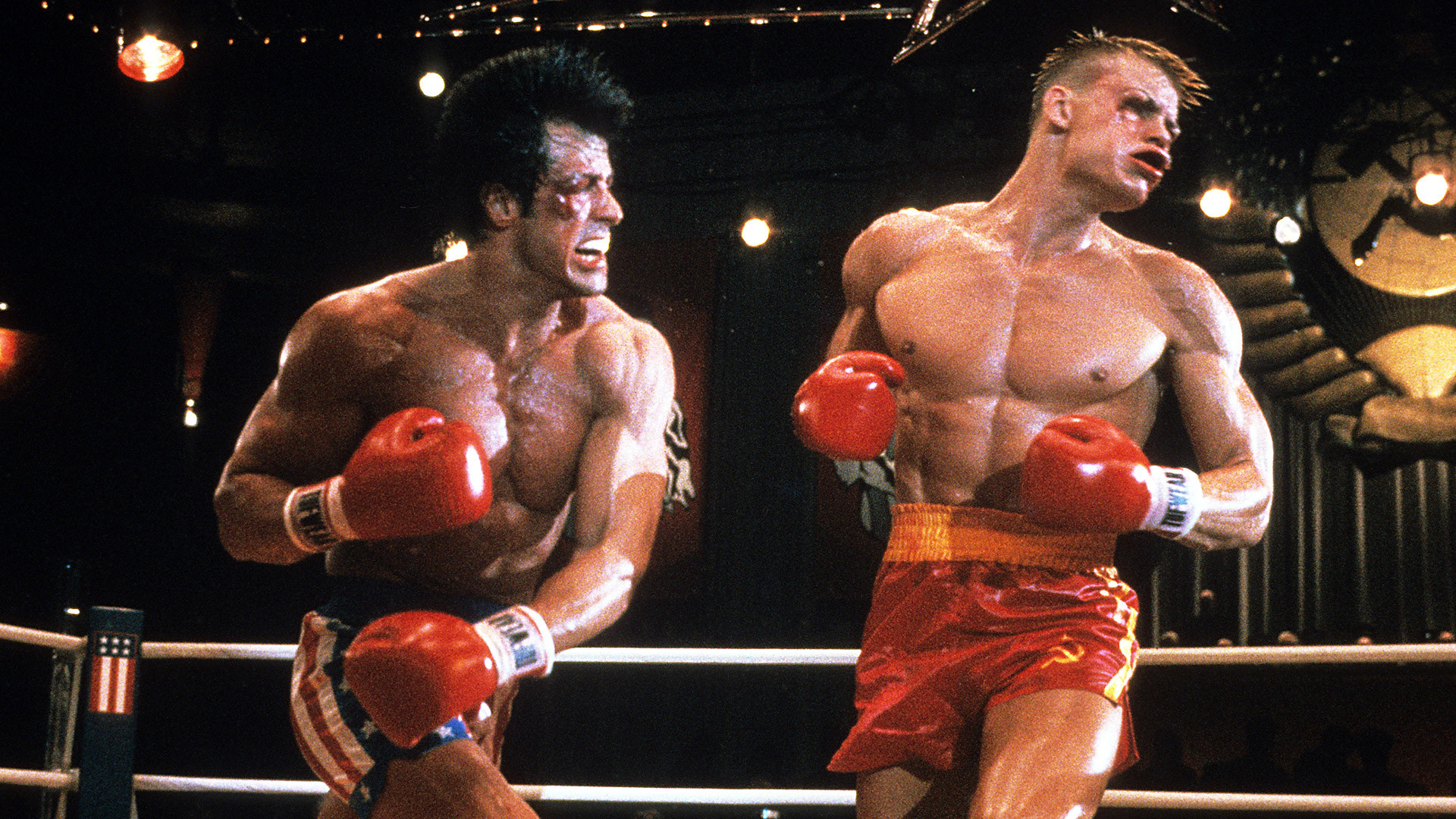 Stallone punches Dolph Lundgren in a scene from the film 'Rocky IV', 1985.