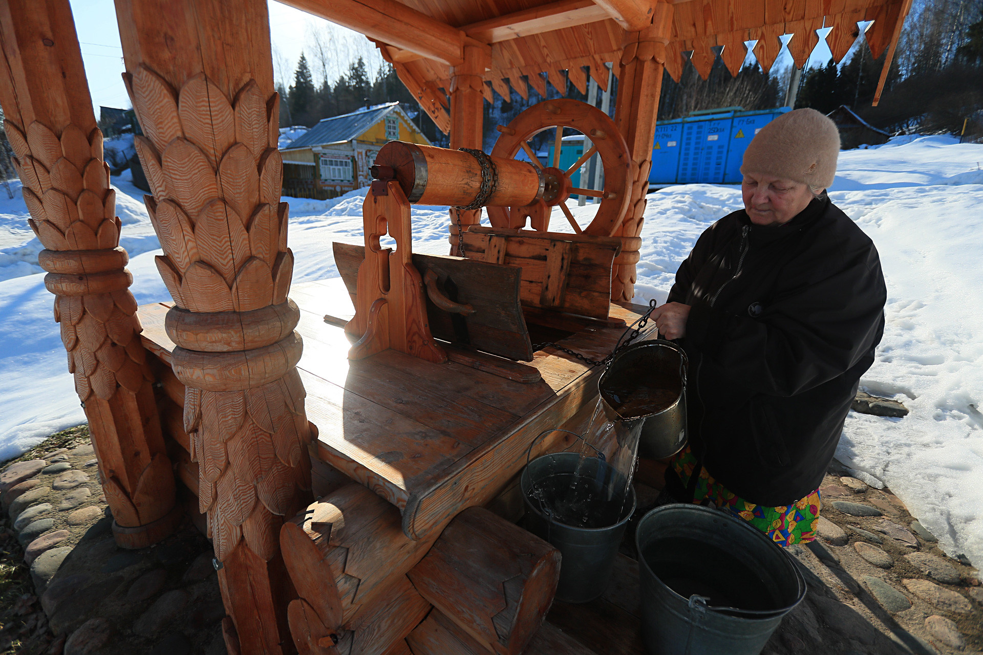 A woman takes water out of a well in the town of Plyos, Ivanovo Region.